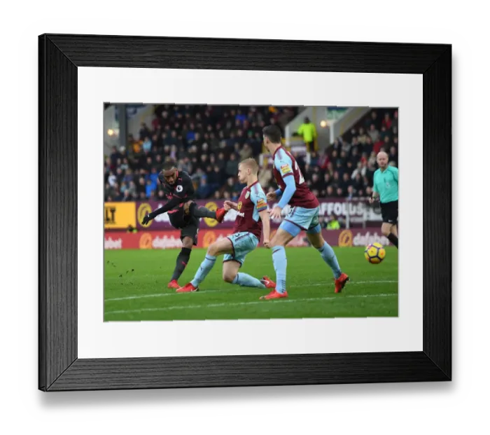 Framed Print : Clash at Turf Moor: Lacazette vs Mee in Intense Battle at Burnley-Arsenal Premier League Match