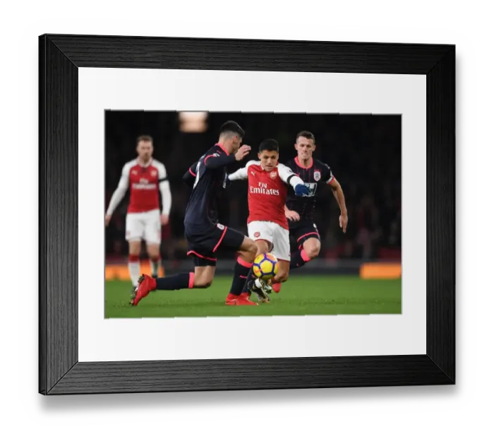 Framed Print : Clash of Champions: Sanchez vs. Schindler in Arsenal's Battle against Huddersfield