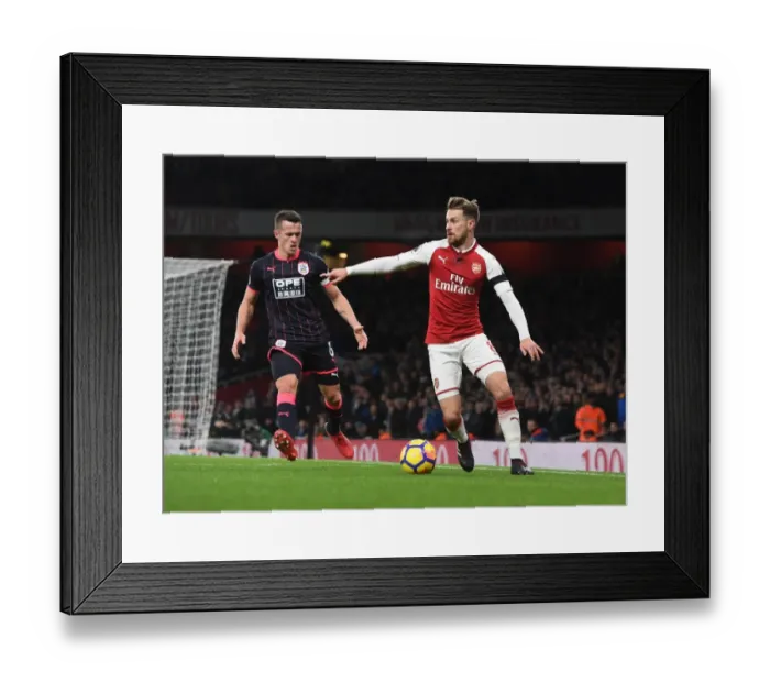 Framed Print : Arsenal's Ramsey Battles Huddersfield's Hogg in Premier League Clash