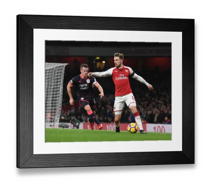 Framed Print : Arsenal's Ramsey Clashes with Huddersfield's Hogg in Premier League Showdown Framed Print : Arsenal's Ramsey Clashes with Huddersfield's Hogg in Premier League Showdown