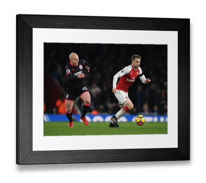 Framed Print : Arsenal's Ramsey Clashes with Huddersfield's Mooy in Premier League Showdown
