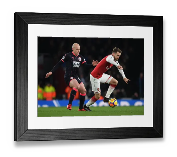 Framed Print : Clash of the Midfield Titans: Ramsey vs Mooy - Arsenal's Premier League Showdown