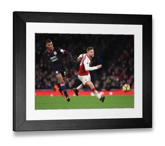 Framed Print : Mustafi vs. Mounie: Intense Battle at Emirates Stadium - Arsenal v Huddersfield Town, Premier League Framed Print : Mustafi vs. Mounie: Intense Battle at Emirates Stadium - Arsenal v Huddersfield Town, Premier League
