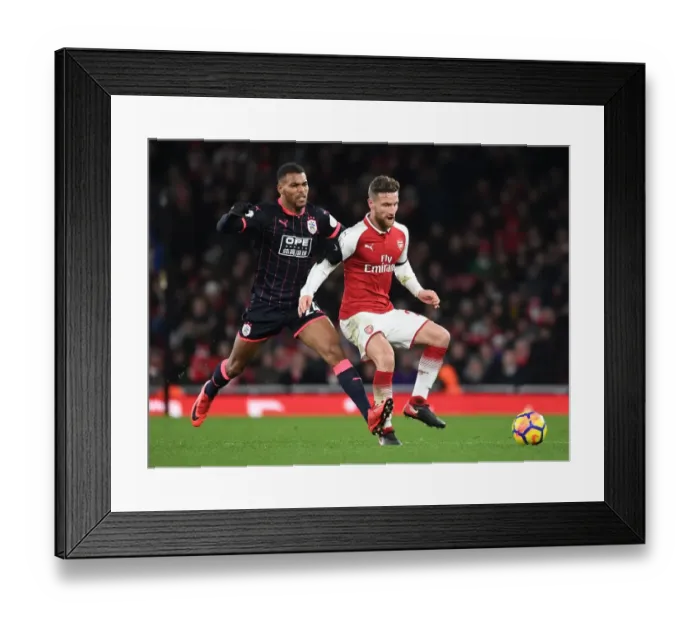 Framed Print : Mustafi vs Mounie: A Premier League Battle at Emirates Stadium