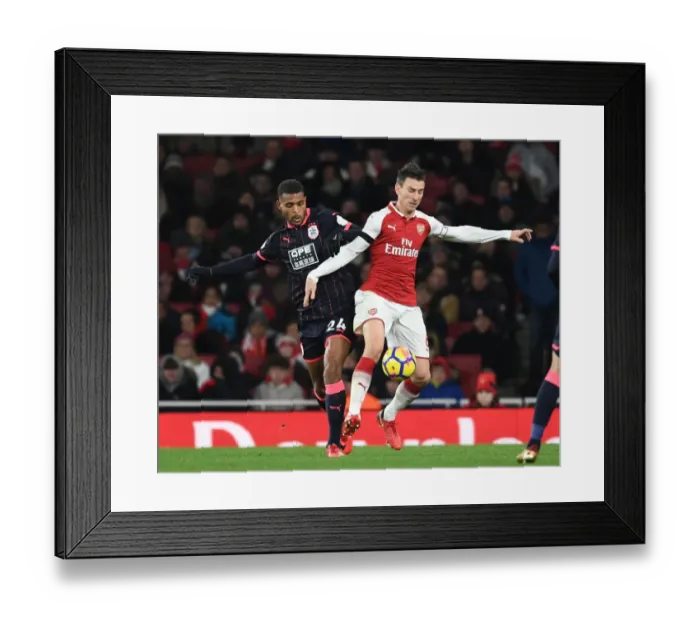 Framed Print : Clash of Titans: Koscielny vs Mounie in Arsenal's Battle against Huddersfield Framed Print : Clash of Titans: Koscielny vs Mounie in Arsenal's Battle against Huddersfield