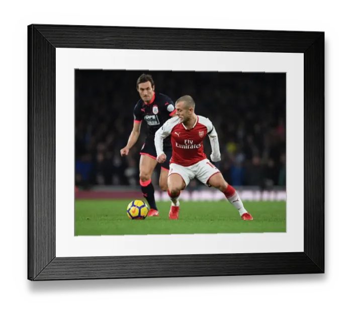 Framed Print : Arsenal's Jack Wilshere Clashes with Huddersfield's Dean Whitehead in Premier League Showdown Framed Print : Arsenal's Jack Wilshere Clashes with Huddersfield's Dean Whitehead in Premier League Showdown