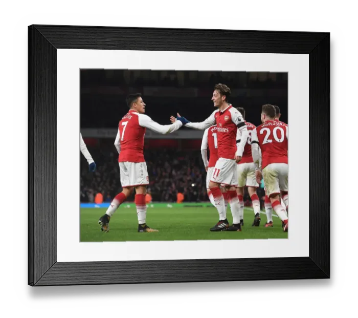 Framed Print : Sanchez and Ozil Celebrate Arsenal's Goals Against Huddersfield Town (2017-18)