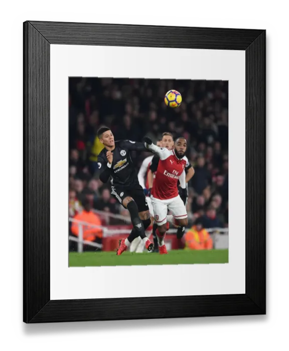 Framed Print : Arsenal's Lacazette Faces Off Against Manchester United's Rojo in Intense Premier League Clash Framed Print : Arsenal's Lacazette Faces Off Against Manchester United's Rojo in Intense Premier League Clash