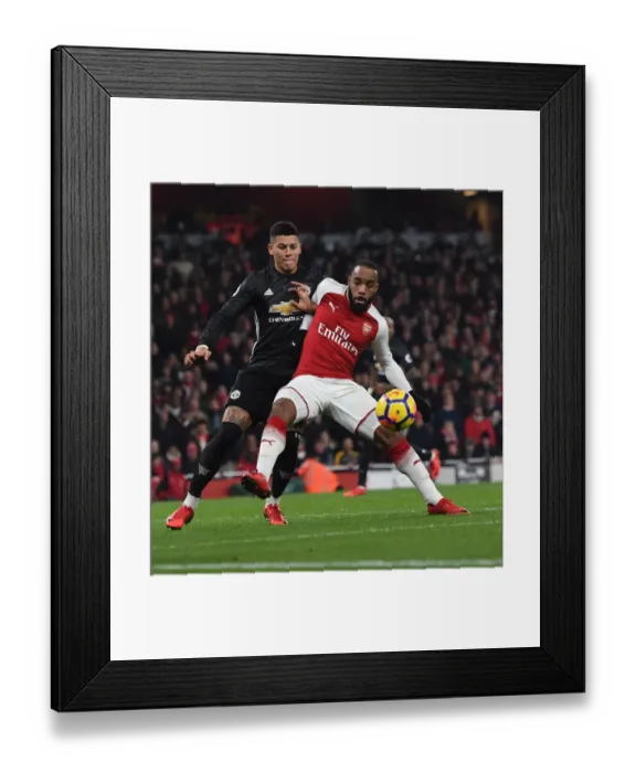 Framed Print : Intense Face-Off: Lacazette vs. Rojo - Arsenal vs. Manchester United Premier League Clash