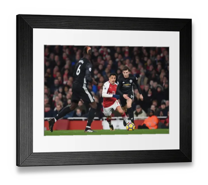 Framed Print : Sanchez vs. Lindelof: A Premier League Battle at the Emirates