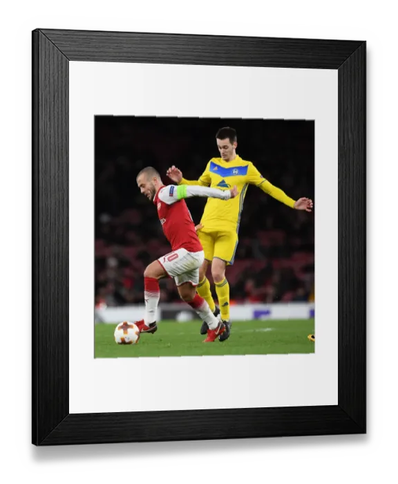 Framed Print : Jack Wilshere vs Mirko Ivanic: Battle in the Europa League - Arsenal v BATE Borisov
