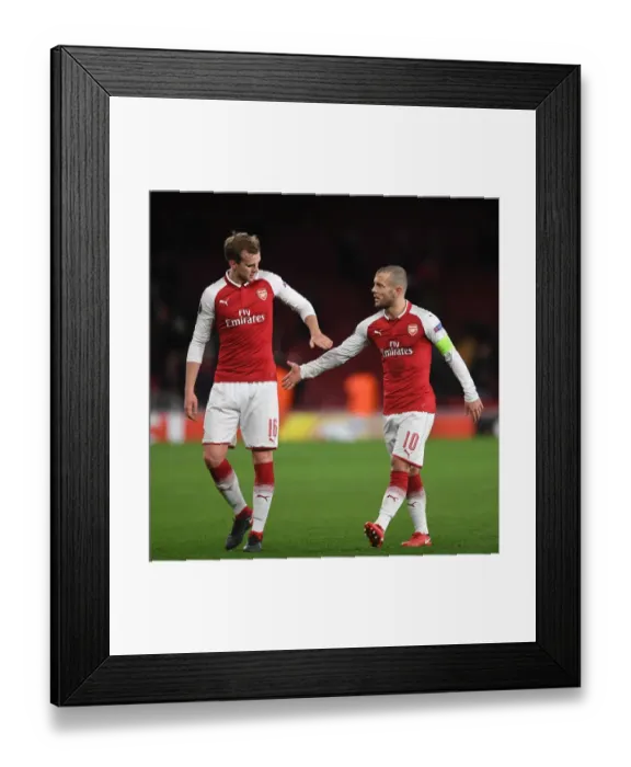 Framed Print : Arsenal Duo Jack Wilshere and Rob Holding Celebrate Victory Over BATE Borisov