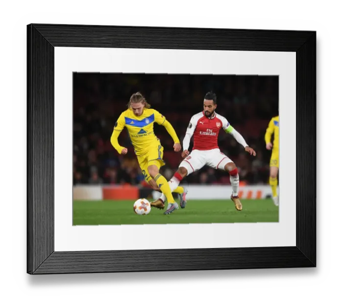 Framed Print : Theo Walcott vs Maksim Volodko: Arsenal FC vs BATE Borisov, UEFA Europa League Clash