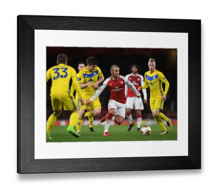 Framed Print : Arsenal's Jack Wilshere vs BATE Borisov's Stanislav Dragun: A Battle in the Europa League Clash