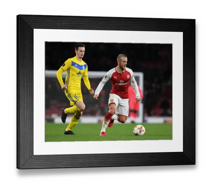 Framed Print : Jack Wilshere's Midfield Mastery: Overpowering Mirko Ivanic for Arsenal in Europa League Clash