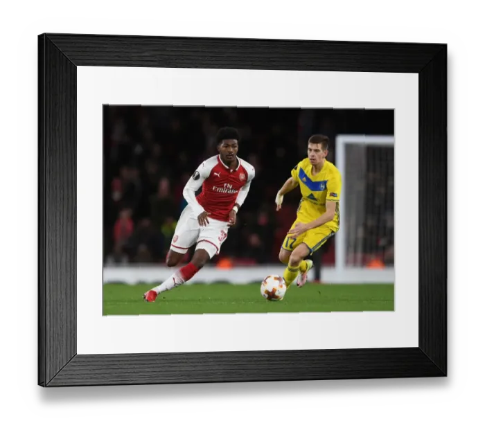 Framed Print : Arsenal's Ainsley Maitland-Niles Faces Off Against BATE Borisov's Aleksei Rios Framed Print : Arsenal's Ainsley Maitland-Niles Faces Off Against BATE Borisov's Aleksei Rios