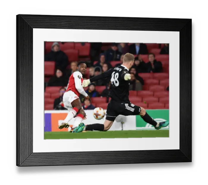 Framed Print : Danny Welbeck vs. Denis Scherbitski: Battle at the Emirates - Arsenal FC vs. BATE Borisov, UEFA Europa League