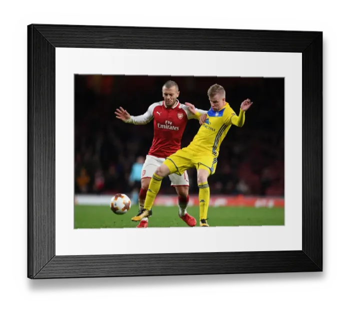 Framed Print : Arsenal's Jack Wilshere vs Evgeni Berezkin: A Battle in the Europa League Clash Framed Print : Arsenal's Jack Wilshere vs Evgeni Berezkin: A Battle in the Europa League Clash
