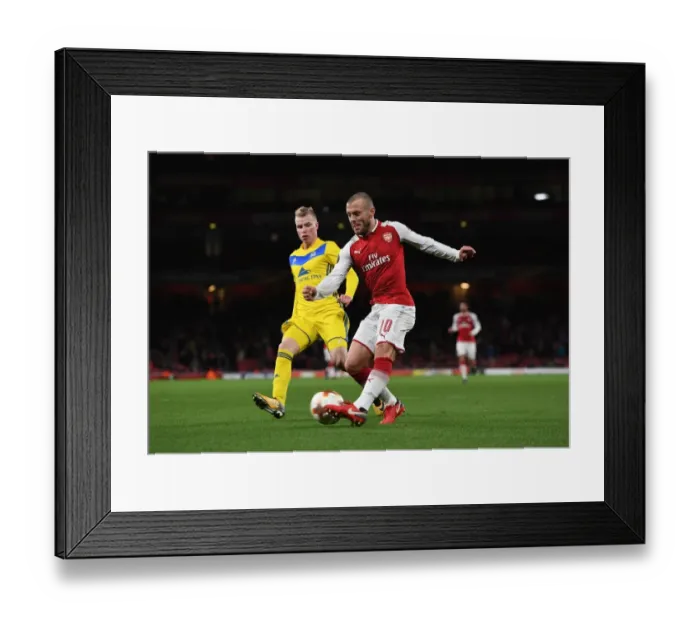 Framed Print : Arsenal's Jack Wilshere Goes Head-to-Head with Evgeni Berezkin in Europa League Showdown Framed Print : Arsenal's Jack Wilshere Goes Head-to-Head with Evgeni Berezkin in Europa League Showdown