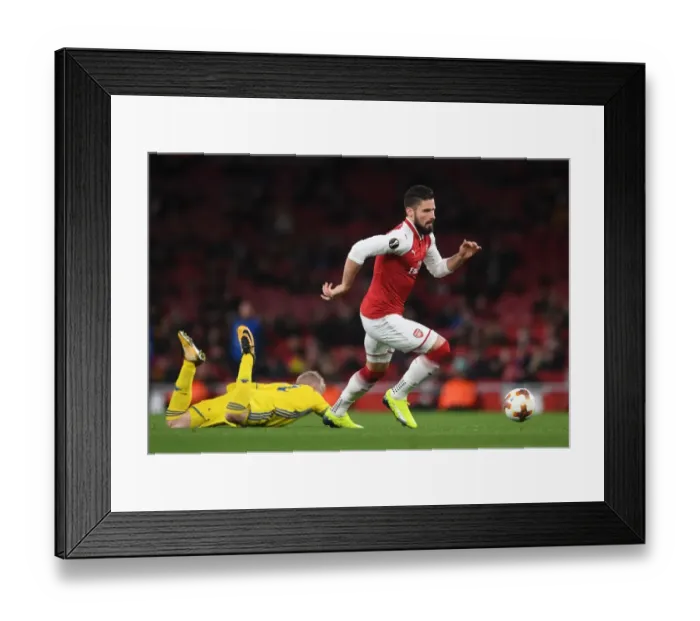 Framed Print : Arsenal's Olivier Giroud Faces Off Against BATE Borisov's Evgeni Berezkin in UEFA Europa League Clash Framed Print : Arsenal's Olivier Giroud Faces Off Against BATE Borisov's Evgeni Berezkin in UEFA Europa League Clash