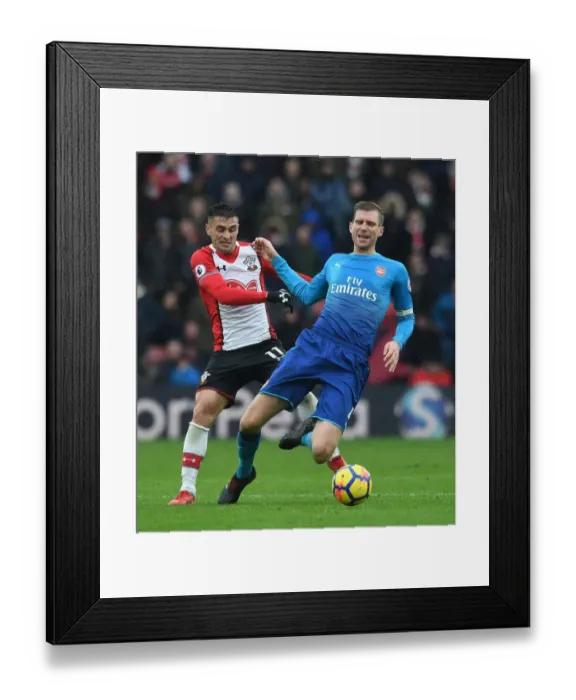 Framed Print : Per Mertesacker vs. Dusan Tadic: Battle at St. Mary's - Southampton v Arsenal, Premier League 2017-18 Framed Print : Per Mertesacker vs. Dusan Tadic: Battle at St. Mary's - Southampton v Arsenal, Premier League 2017-18