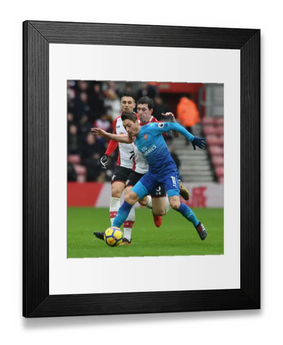 Framed Print : Ozil vs. Hojbjerg: A Premier League Showdown - Arsenal's Mesut Ozil Clashes with Southampton's Pierre-Emile Hojbjberg (December 2017) Framed Print : Ozil vs. Hojbjerg: A Premier League Showdown - Arsenal's Mesut Ozil Clashes with Southampton's Pierre-Emile Hojbjberg (December 2017)