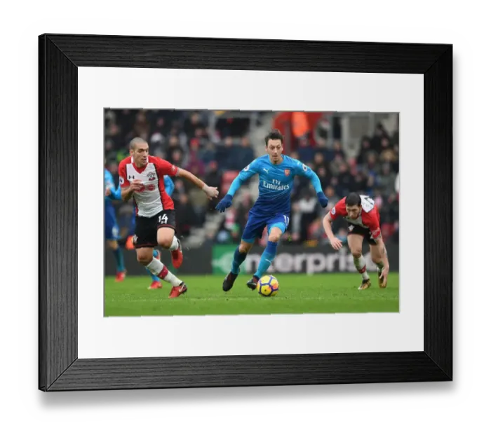 Framed Print : Mesut Ozil Clashes with Hojbjerg and Romeu in Southampton vs Arsenal Premier League Showdown