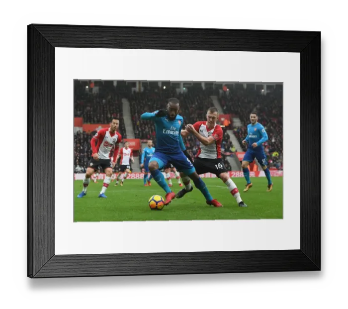 Framed Print : Clash at St. Mary's: Lacazette vs. Ward-Prowse in Southampton v Arsenal Premier League Showdown Framed Print : Clash at St. Mary's: Lacazette vs. Ward-Prowse in Southampton v Arsenal Premier League Showdown