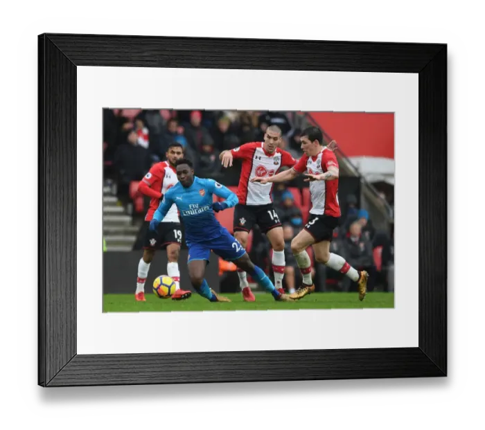 Framed Print : Clash at St. Mary's: Welbeck Faces Off Against Hojbjerg and Romeu in Southampton vs. Arsenal Premier League Showdown