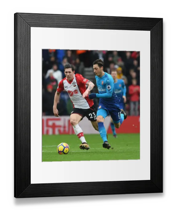Framed Print : Arsenal's Aaron Ramsey Faces Off Against Southampton's Pierre-Emile Hojbjerg in Premier League Clash Framed Print : Arsenal's Aaron Ramsey Faces Off Against Southampton's Pierre-Emile Hojbjerg in Premier League Clash