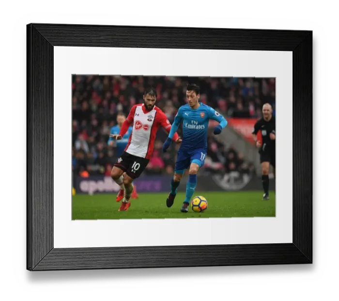 Framed Print : Mesut Ozil vs Charlie Austin: Intense Battle in Southampton v Arsenal, Premier League 2017-18