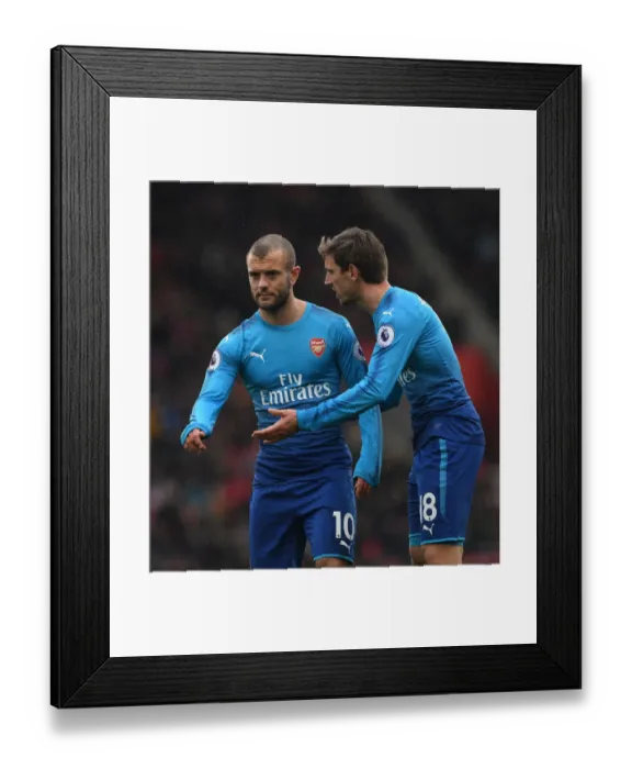 Framed Print : Monreal and Wilshere: Focused on the Ball in Southampton v Arsenal Premier League Clash