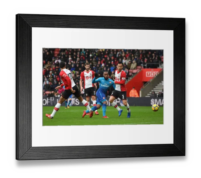 Framed Print : Lacazette vs Yoshida: Intense Moment at Southampton-Arsenal Premier League Clash Framed Print : Lacazette vs Yoshida: Intense Moment at Southampton-Arsenal Premier League Clash