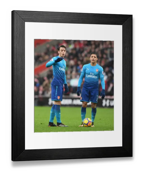 Framed Print : Mesut Ozil and Alexis Sanchez: A Dynamic Duo in Action for Arsenal vs Southampton