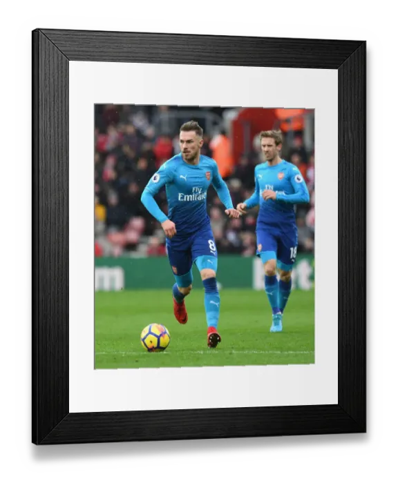 Framed Print : Arsenal's Aaron Ramsey in Action against Southampton in Premier League Clash Framed Print : Arsenal's Aaron Ramsey in Action against Southampton in Premier League Clash