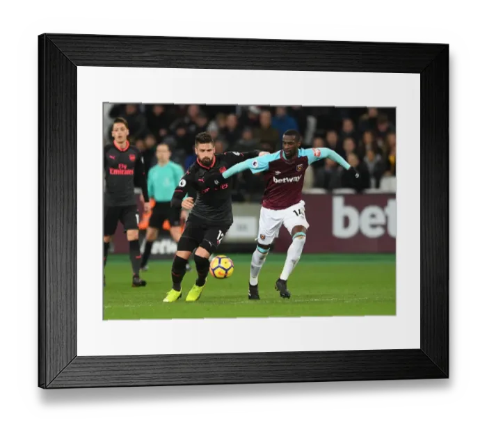 Framed Print : Giroud vs Obiang: A Willful Clash in the Premier League Showdown between Arsenal and West Ham