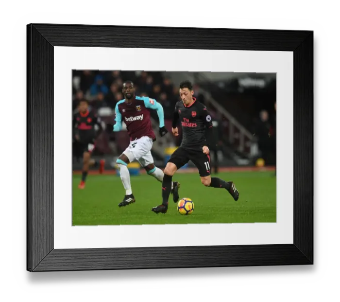 Framed Print : Mesut Ozil vs Pedro Obiang: A Premier League Battle