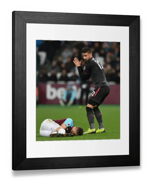 Framed Print : Giroud vs. Cresswell: Intense Moment at the London Derby (West Ham United vs. Arsenal, 2017-18)