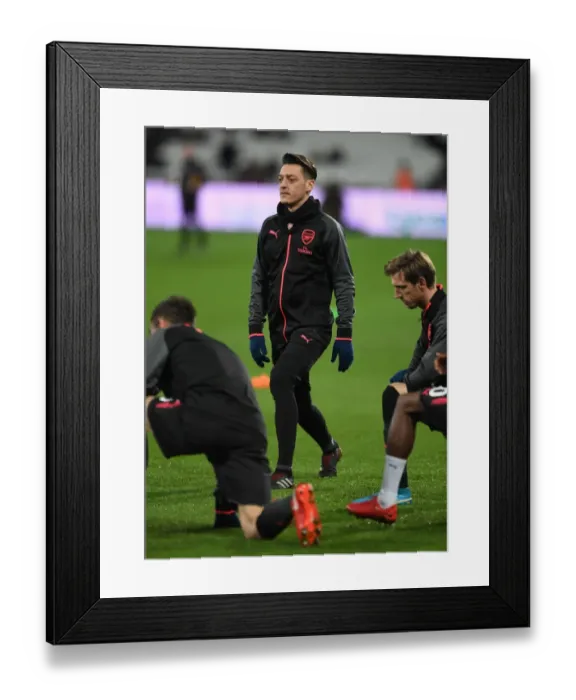Framed Print : Mesut Ozil Prepares for Arsenal's Clash against West Ham United Framed Print : Mesut Ozil Prepares for Arsenal's Clash against West Ham United