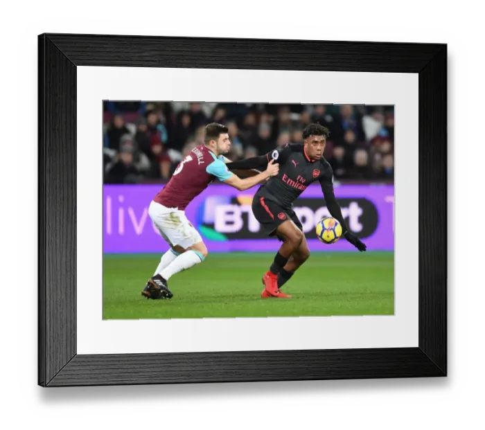 Framed Print : Clash at London Stadium: Iwobi vs Cresswell in the Premier League Battle between West Ham and Arsenal Framed Print : Clash at London Stadium: Iwobi vs Cresswell in the Premier League Battle between West Ham and Arsenal