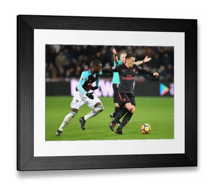 Framed Print : Mesut Ozil vs Pedro Obiang: Intense Clash in West Ham United vs Arsenal Premier League Match