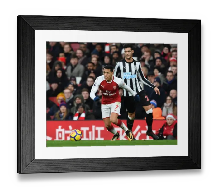 Framed Print : Arsenal's Alexis Sanchez Outmaneuvers Newcastle's Mikel Merino during Premier League Clash