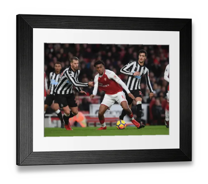 Framed Print : Arsenal's Alex Iwobi Faces Off Against Newcastle's Mikel Merino and Florian Lejeune Framed Print : Arsenal's Alex Iwobi Faces Off Against Newcastle's Mikel Merino and Florian Lejeune
