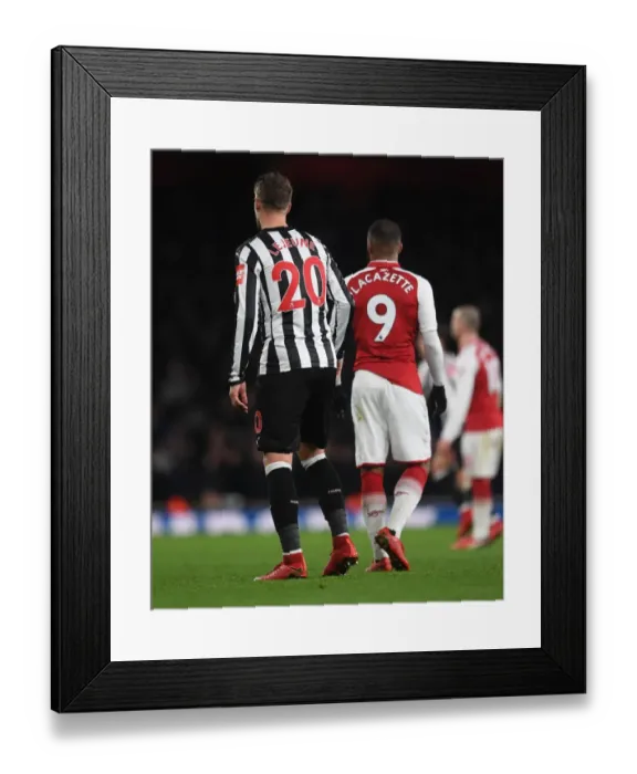 Framed Print : Arsenal's Lacazette Clashes with Newcastle's Lejeune in Premier League Showdown Framed Print : Arsenal's Lacazette Clashes with Newcastle's Lejeune in Premier League Showdown
