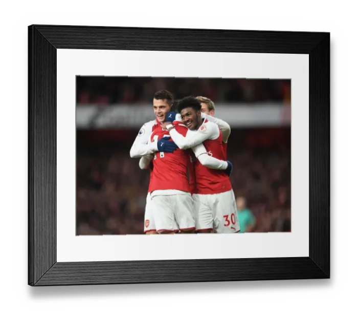 Framed Print : Arsenal's Triumph: Ozil, Xhaka, Maitland-Niles in Unison - Goal Celebration (2017-18)