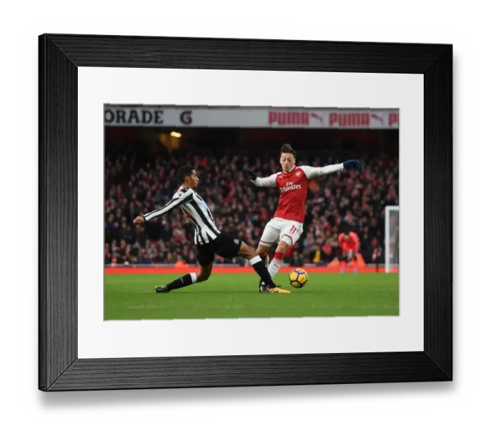 Framed Print : Mesut Ozil vs. Isaac Hayden: Intense Battle at Arsenal's Emirates Stadium (Arsenal v Newcastle United 2017-18)