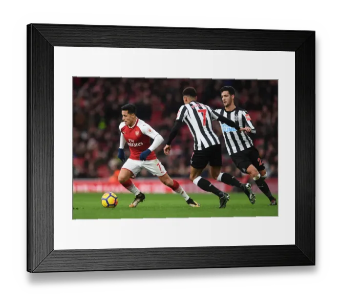 Framed Print : Arsenal's Alexis Sanchez Faces Off Against Newcastle's Mikel Merino and Jacob Murphy in Intense Premier League Clash