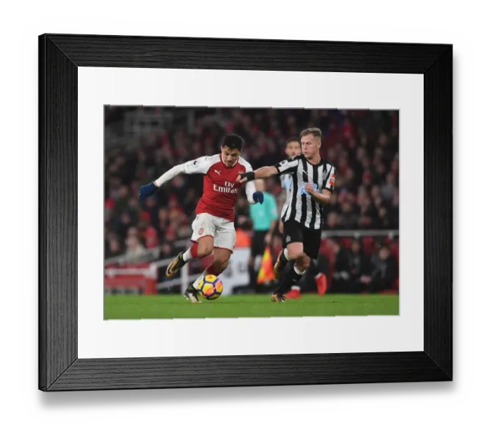 Framed Print : Arsenal's Alexis Sanchez vs. Newcastle's Matt Ritchie: A Premier League Showdown Framed Print : Arsenal's Alexis Sanchez vs. Newcastle's Matt Ritchie: A Premier League Showdown