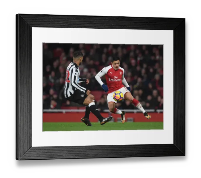 Framed Print : Intense Rivalry: Sanchez vs. Yedlin in Arsenal's Clash with Newcastle United