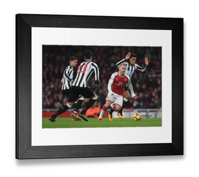Framed Print : Arsenal's Jack Wilshere Clashes with Newcastle's Midfield Trio during Premier League Match Framed Print : Arsenal's Jack Wilshere Clashes with Newcastle's Midfield Trio during Premier League Match